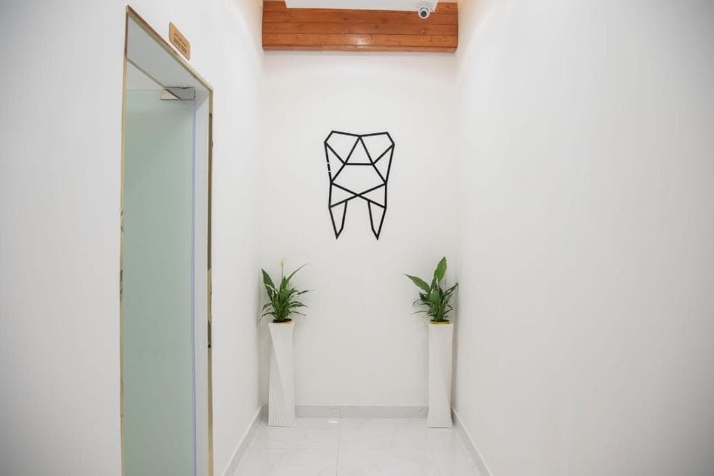 360Care minimalist clinic corridor and geometric sculpture